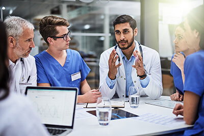 Doctor talking to group