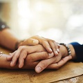 This is a photo of two people holding hands.