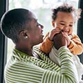 a woman holds a baby